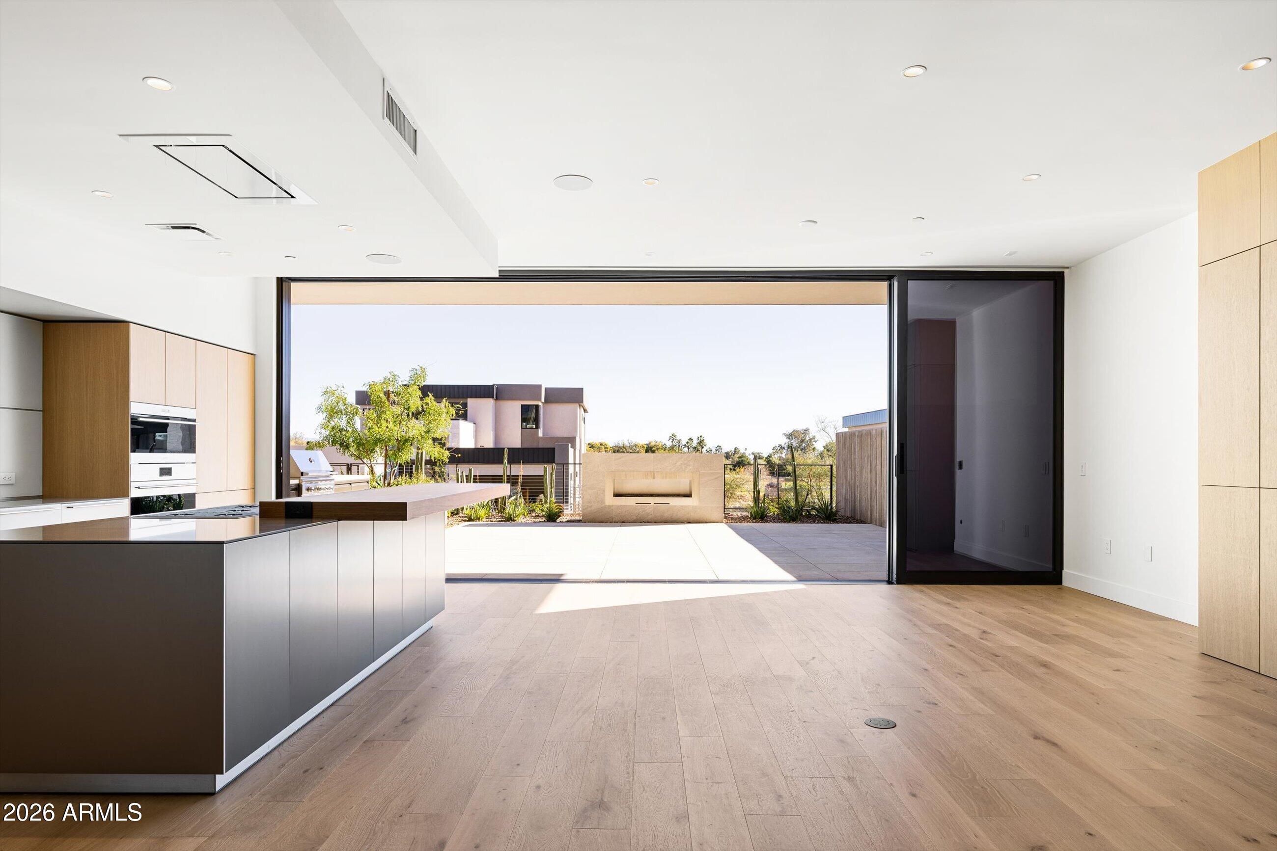 4849 North Camelback Ridge Road, Unit B104 Scottsdale, AZ 85251 - Photo 11 of 41 a view of a living room and a floor to ceiling window