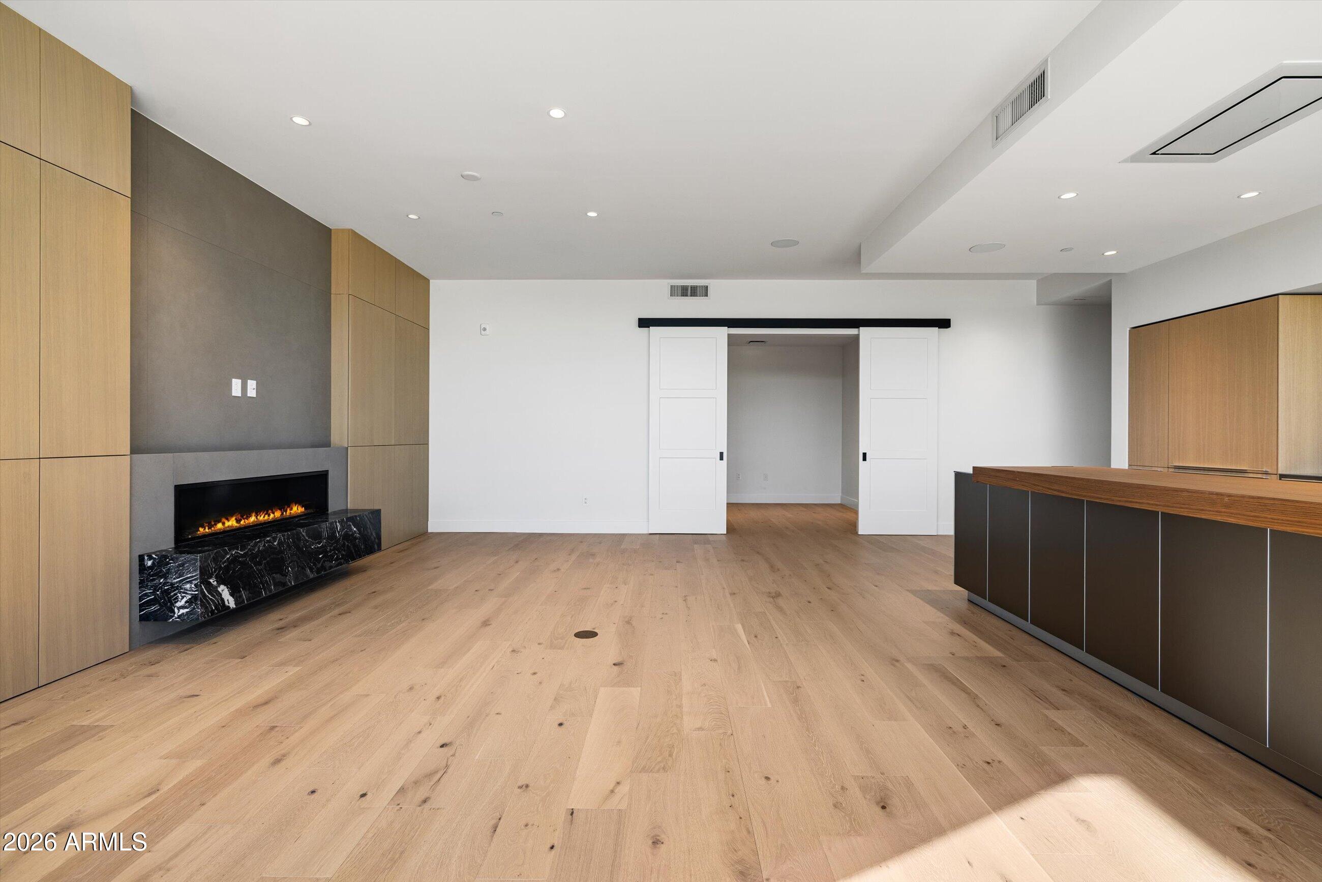 4849 North Camelback Ridge Road, Unit B104 Scottsdale, AZ 85251 - Photo 7 of 41 a view of a livingroom with a fireplace