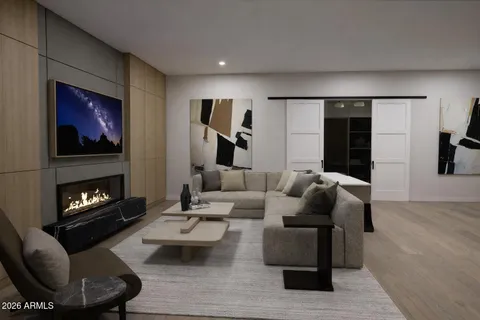 a view of a room with wooden floor