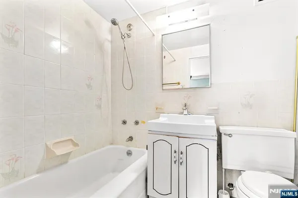 a bathroom with a sink a toilet and a bathtub
