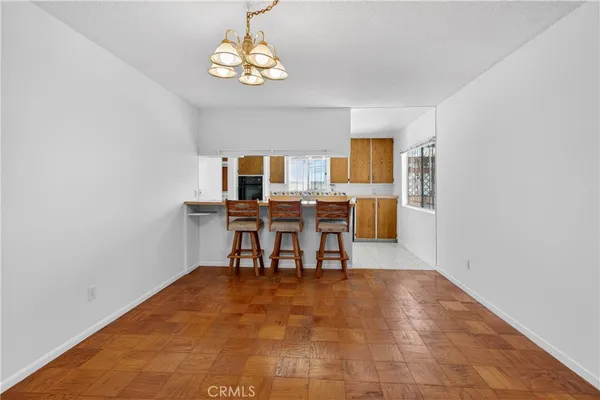 a kitchen with stainless steel appliances a sink stove and cabinets