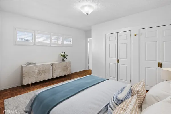 a bedroom with a bed and a couch