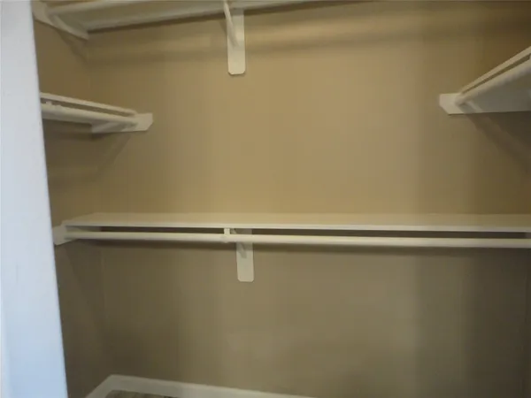 a view of a bathtub in bathroom and mirror