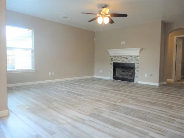a large kitchen with granite countertop a large counter top stainless steel appliances and cabinets