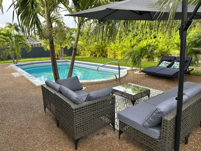 a view of yard with patio