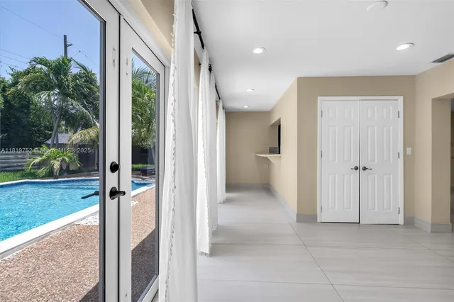 a view of a bathroom with a shower and a sink
