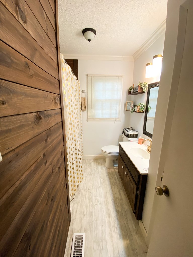 173 Magnolia Street Camden, TN 38320 - Photo 14 of 22 a view of a hallway with seating area