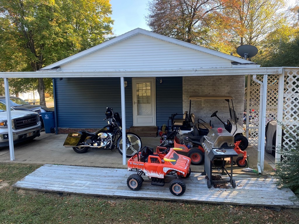 173 Magnolia Street Camden, TN 38320 - Photo 19 of 22 a car parked in front of a house