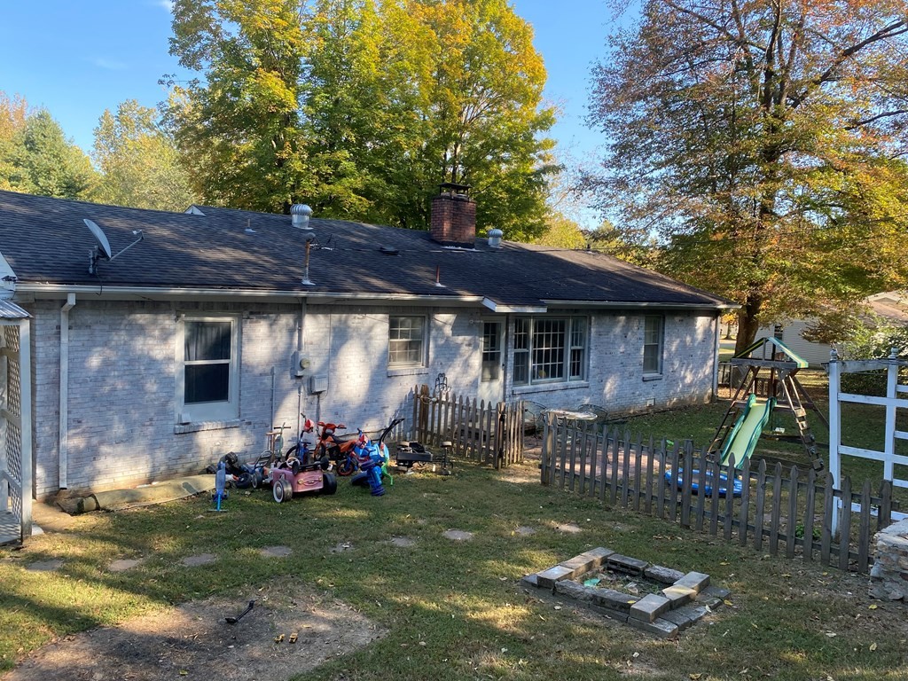 173 Magnolia Street Camden, TN 38320 - Photo 21 of 22 a view of a house with backyard and sitting area