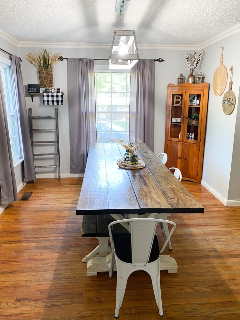 173 Magnolia Street Camden, TN 38320 - Photo 7 of 22 a room with wooden floor and furniture