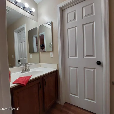 a bathroom with a double vanity sink and mirror
