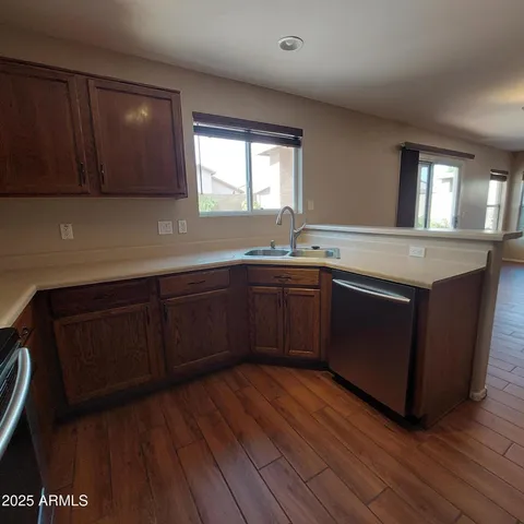 a kitchen with sink and cabinets