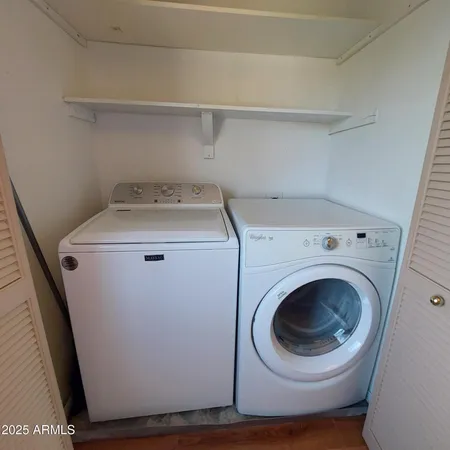 a utility room with dryer and washer