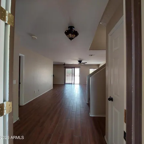 a view of gallery with wooden floor