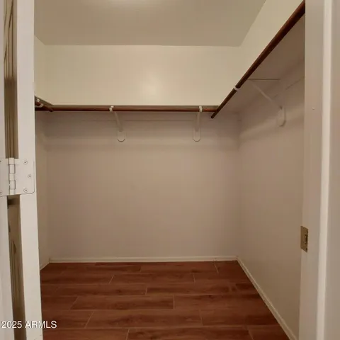 a view of an empty walk in closet