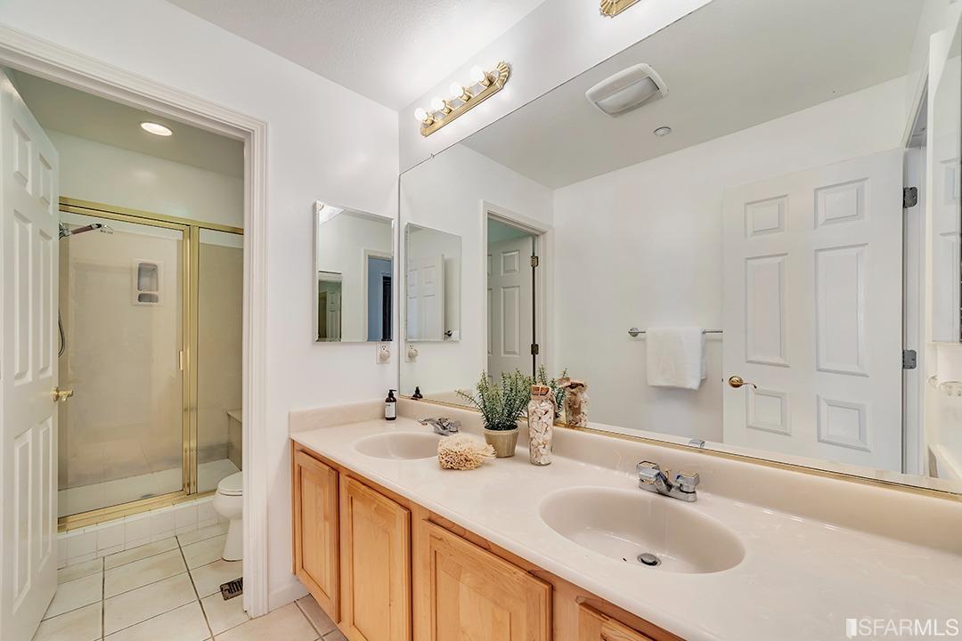360 Goodwin Drive San Bruno, CA 94066 - Photo 14 of 43 a bathroom with a sink double vanity shower and a mirror