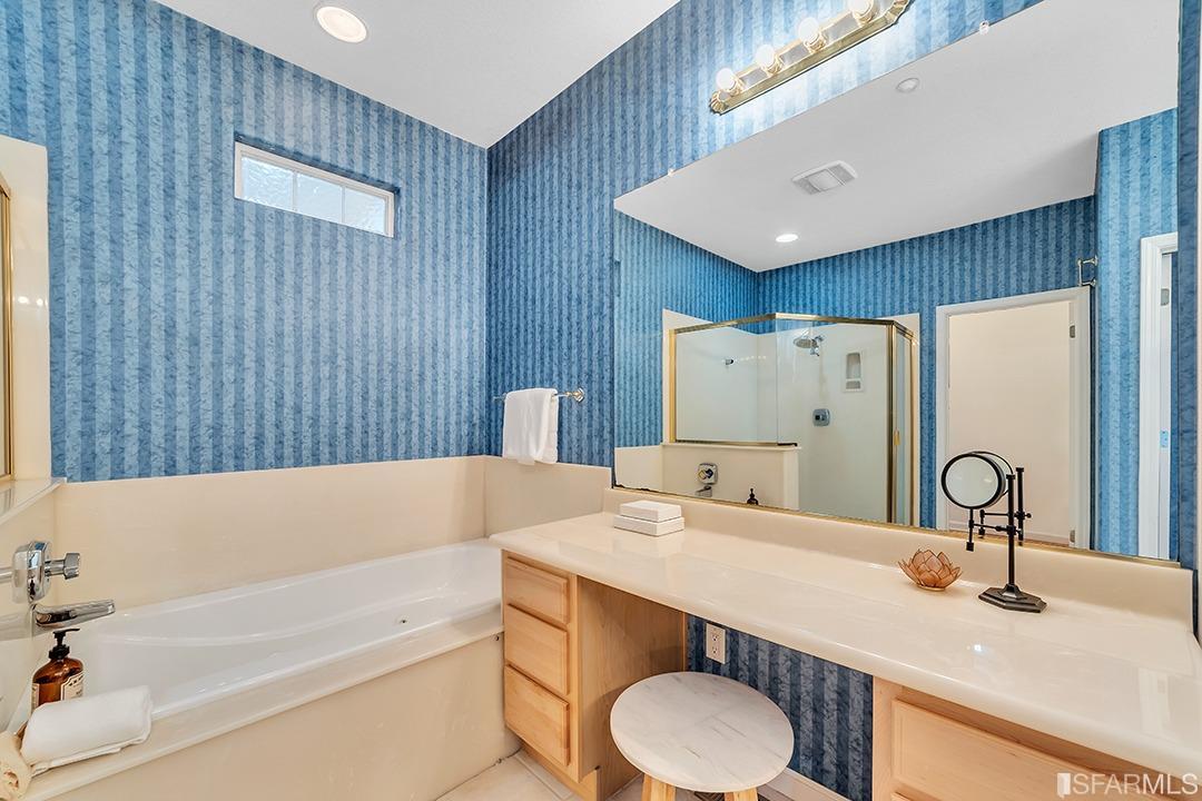 360 Goodwin Drive San Bruno, CA 94066 - Photo 18 of 43 a bathroom with a tub sink and mirror