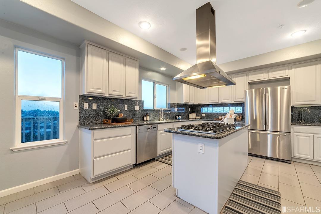 360 Goodwin Drive San Bruno, CA 94066 - Photo 33 of 43 a kitchen with stainless steel appliances granite countertop a stove a sink and a refrigerator