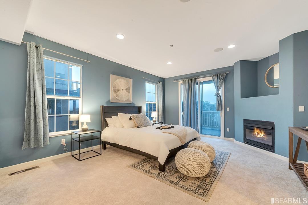 360 Goodwin Drive San Bruno, CA 94066 - Photo 34 of 43 a bedroom with a bed and a fireplace