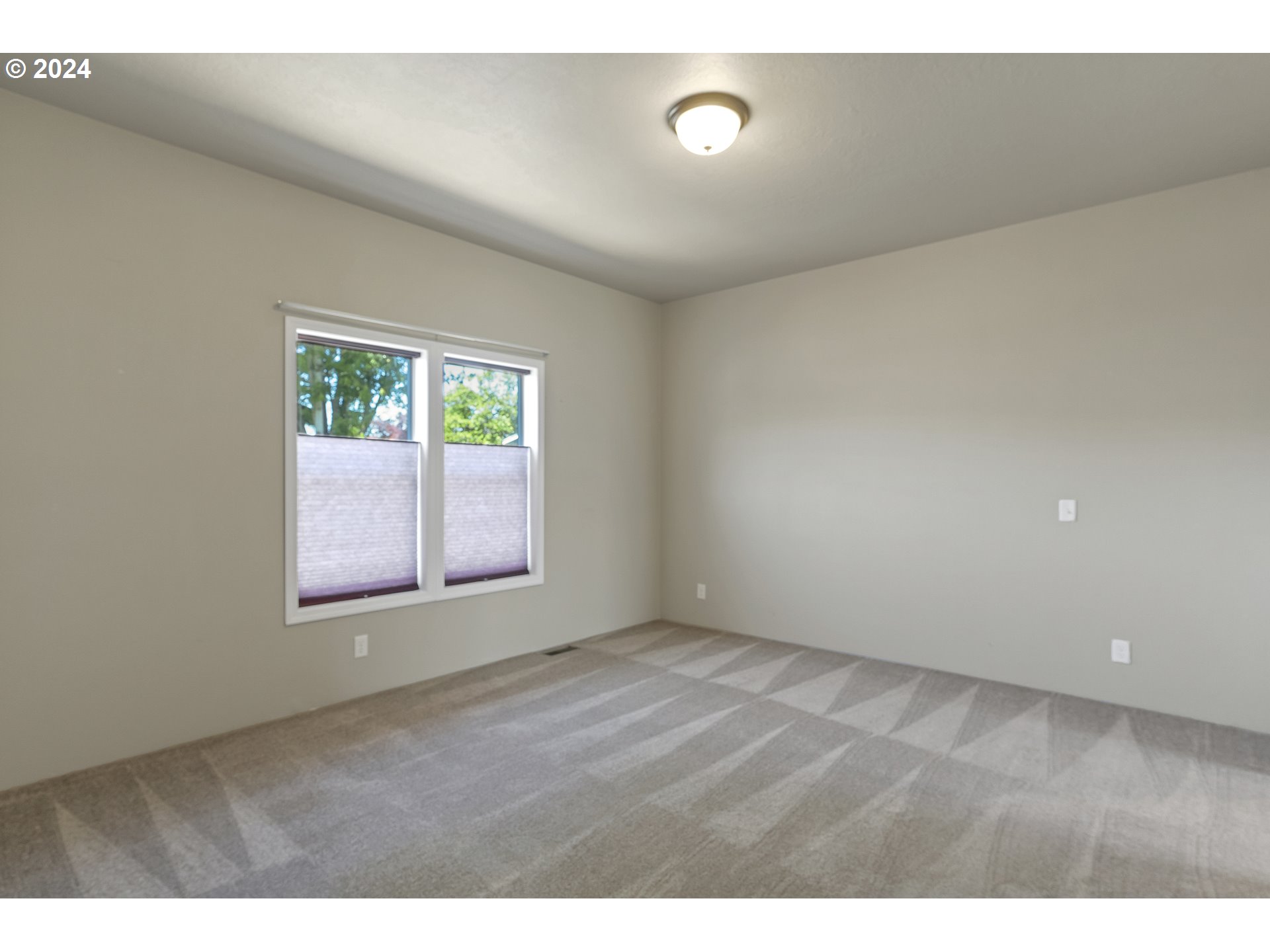 610 Vaughan Lane Lebanon, OR 97355 - Photo 17 of 35 an empty room with windows
