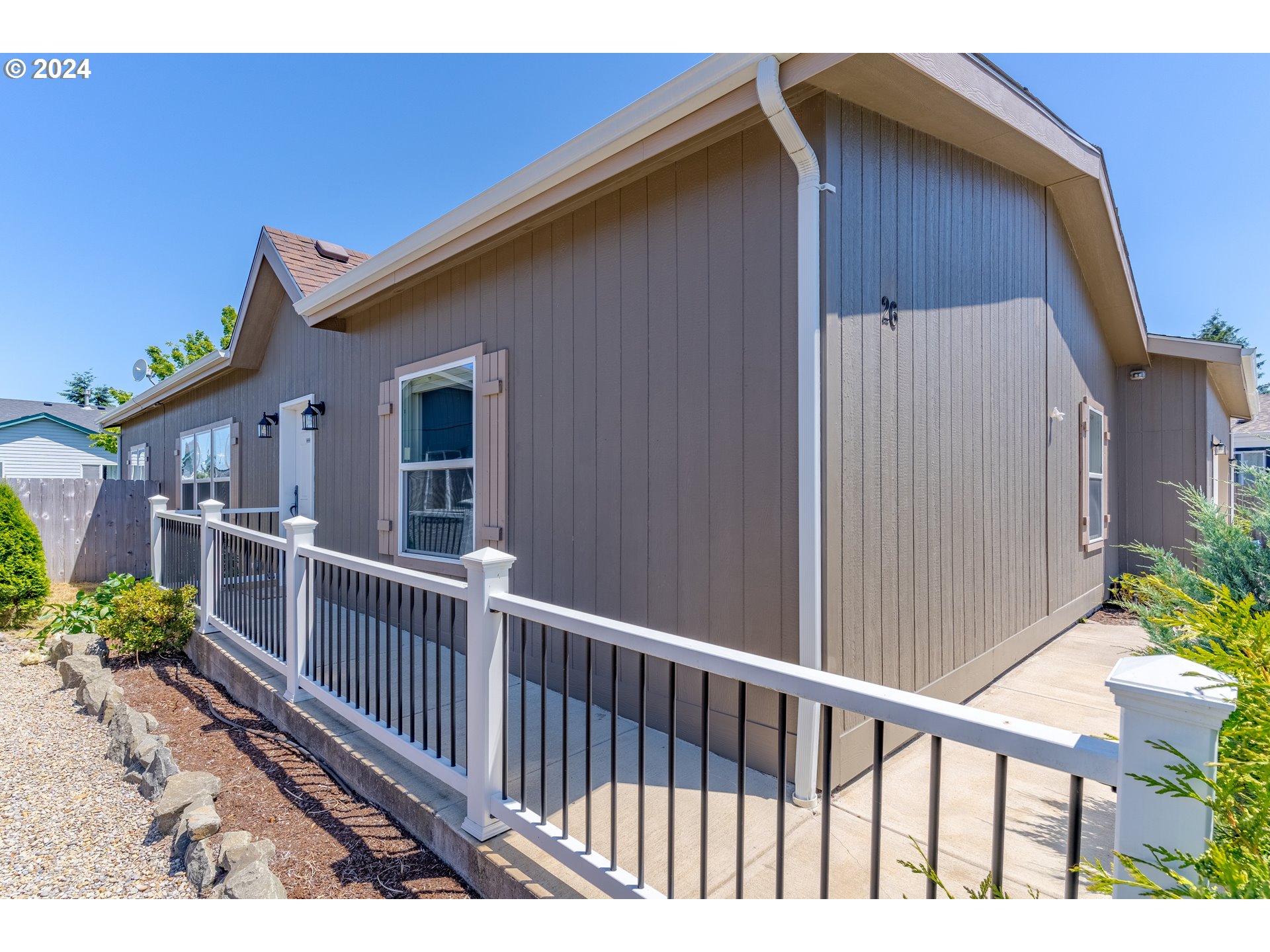 610 Vaughan Lane Lebanon, OR 97355 - Photo 6 of 35 a view of a house with wooden fence