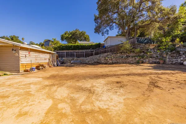a view of a backyard of a house