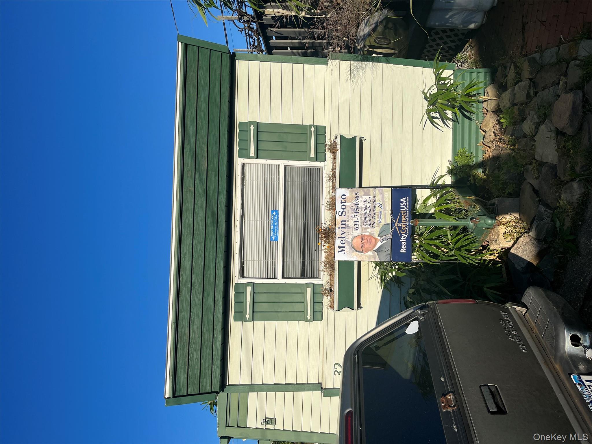 a backyard of a house with yard and outdoor seating