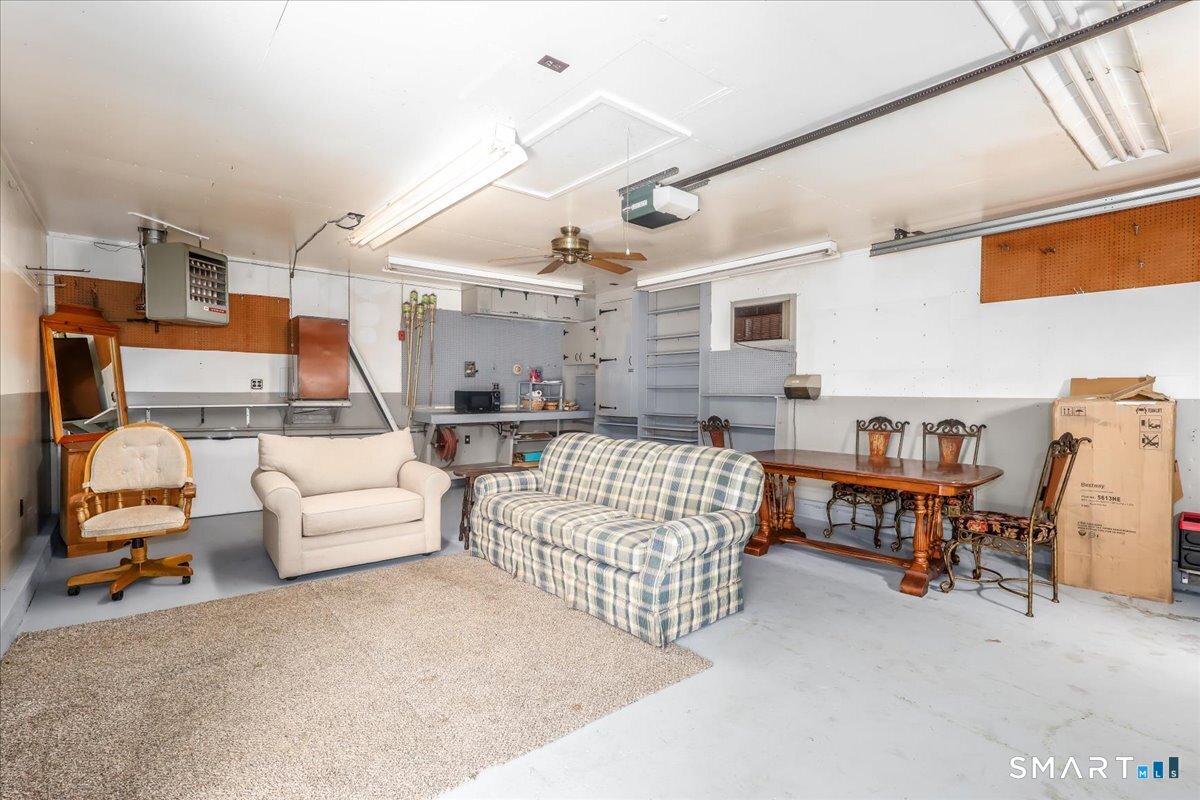 306 Welton Street Hamden, CT 06517 - Photo 37 of 38 a living room with furniture and a table