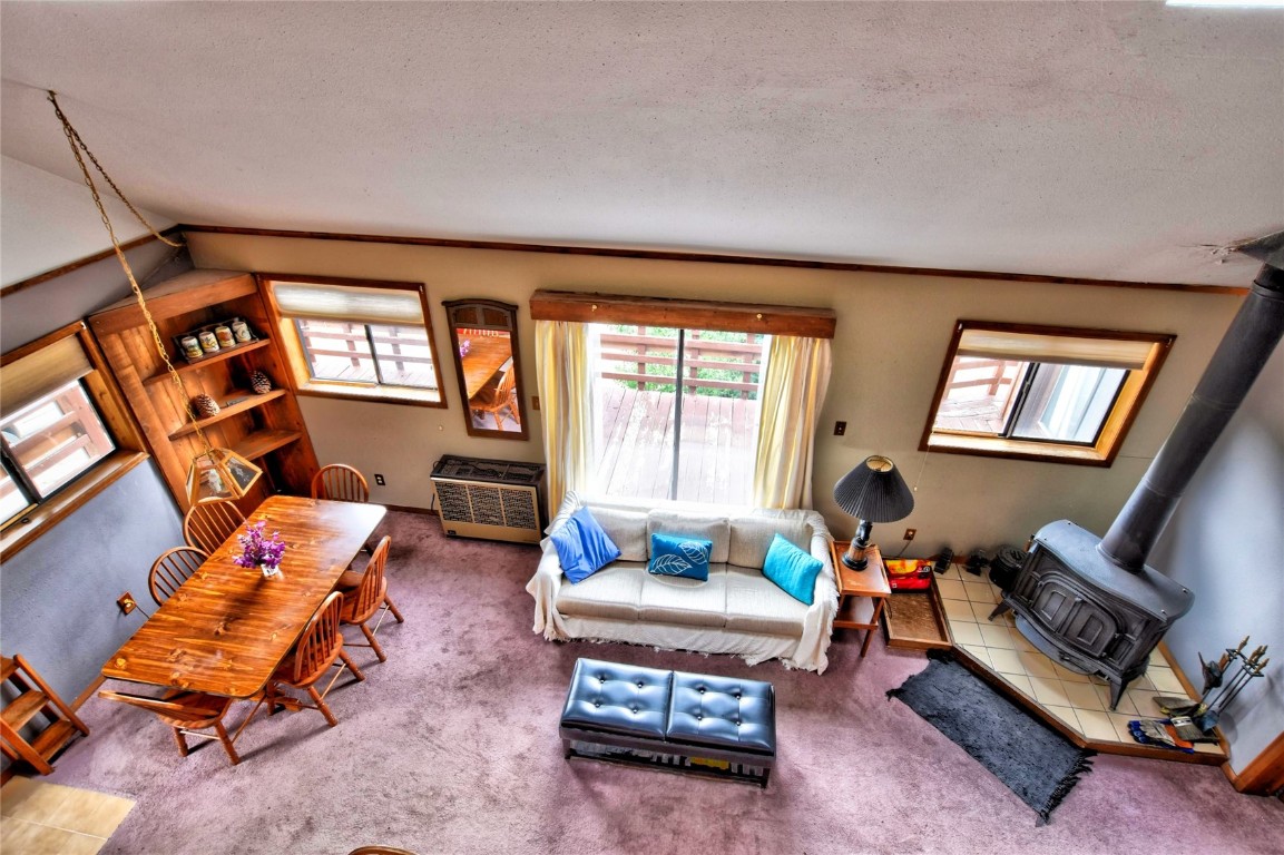 1722 Stagestop Road Jefferson, CO 80456 - Photo 17 of 25 a living room with furniture a rug and a window