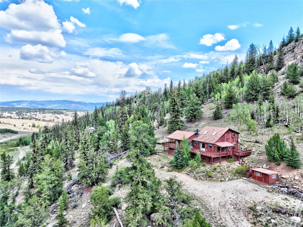 1722 Stagestop Road Jefferson, CO 80456 - Photo 2 of 25 a view of a yard with a fountain