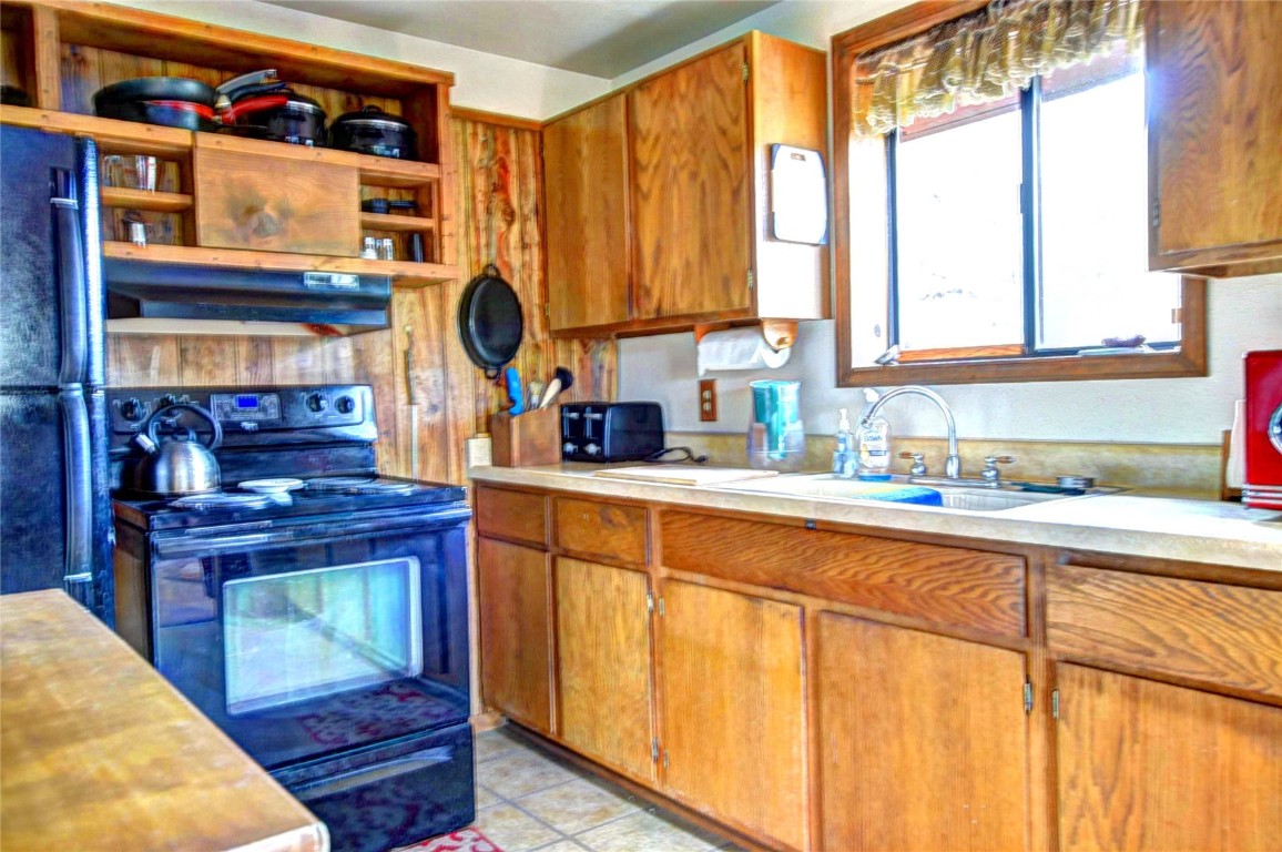 1722 Stagestop Road Jefferson, CO 80456 - Photo 6 of 25 a kitchen with stainless steel appliances granite countertop a sink and a cabinets