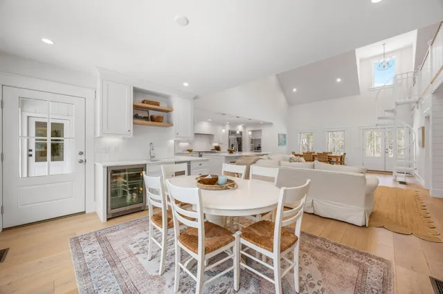 a kitchen with stainless steel appliances kitchen island granite countertop a stove and a refrigerator