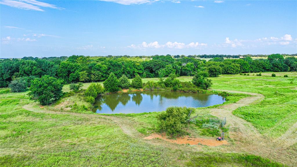 2215 Denver Road Sunset, TX 76270 - Photo 19 of 36 a view of a lake with a yard