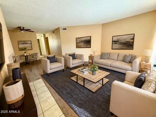 a living room with furniture and a rug