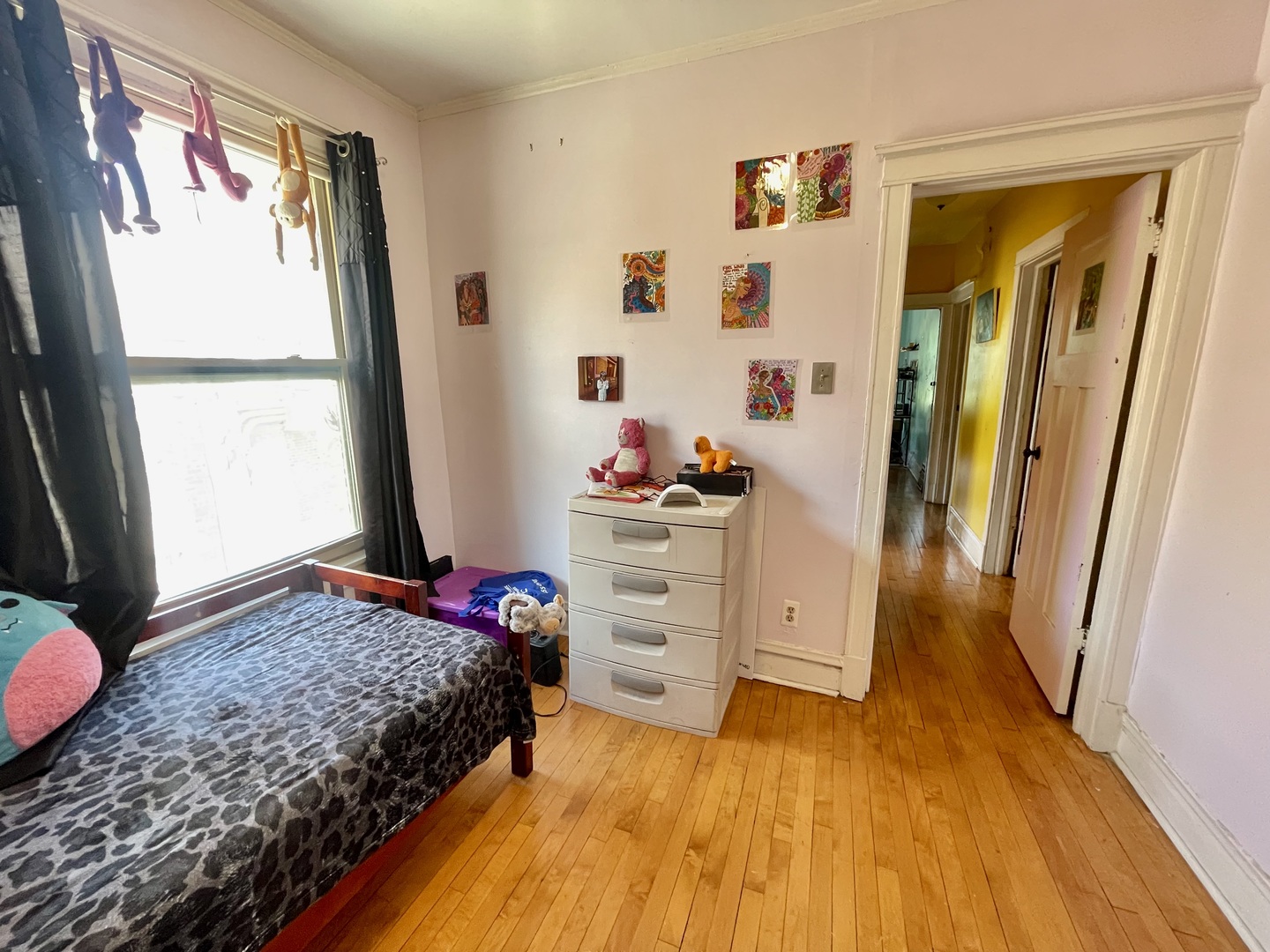 7916 South Constance Avenue Chicago, IL 60617 - Photo 22 of 28 a bedroom with a bed and a window