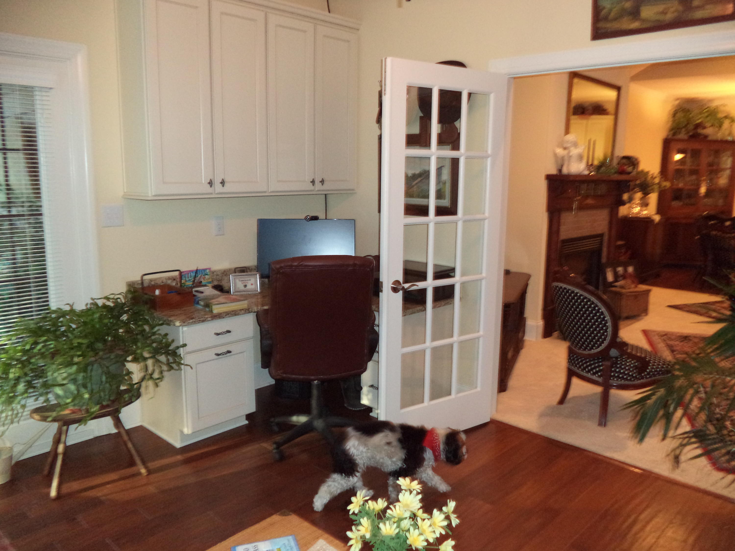 Carolina room has a custom granite top desk & French doors