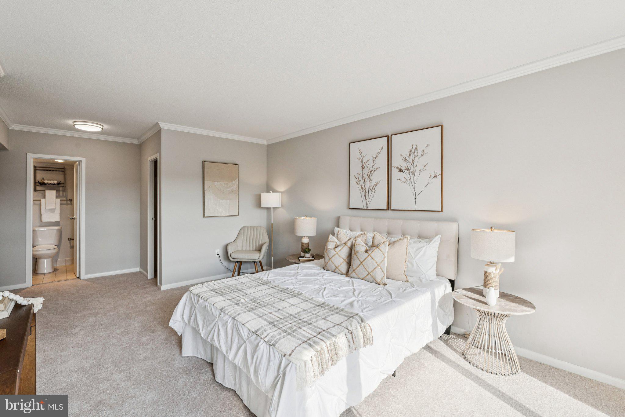 400 Madison Street, Unit 603 Alexandria, VA 22314 - Photo 20 of 46 a bedroom with a bed and a painting on the wall