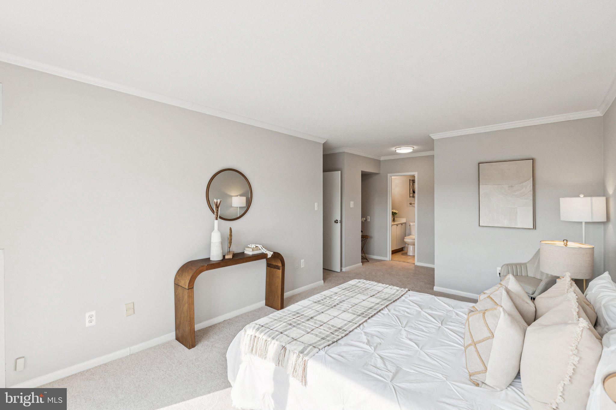 400 Madison Street, Unit 603 Alexandria, VA 22314 - Photo 21 of 46 a bedroom with bed and window