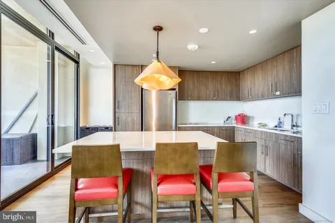a view of a balcony with chair and dryer