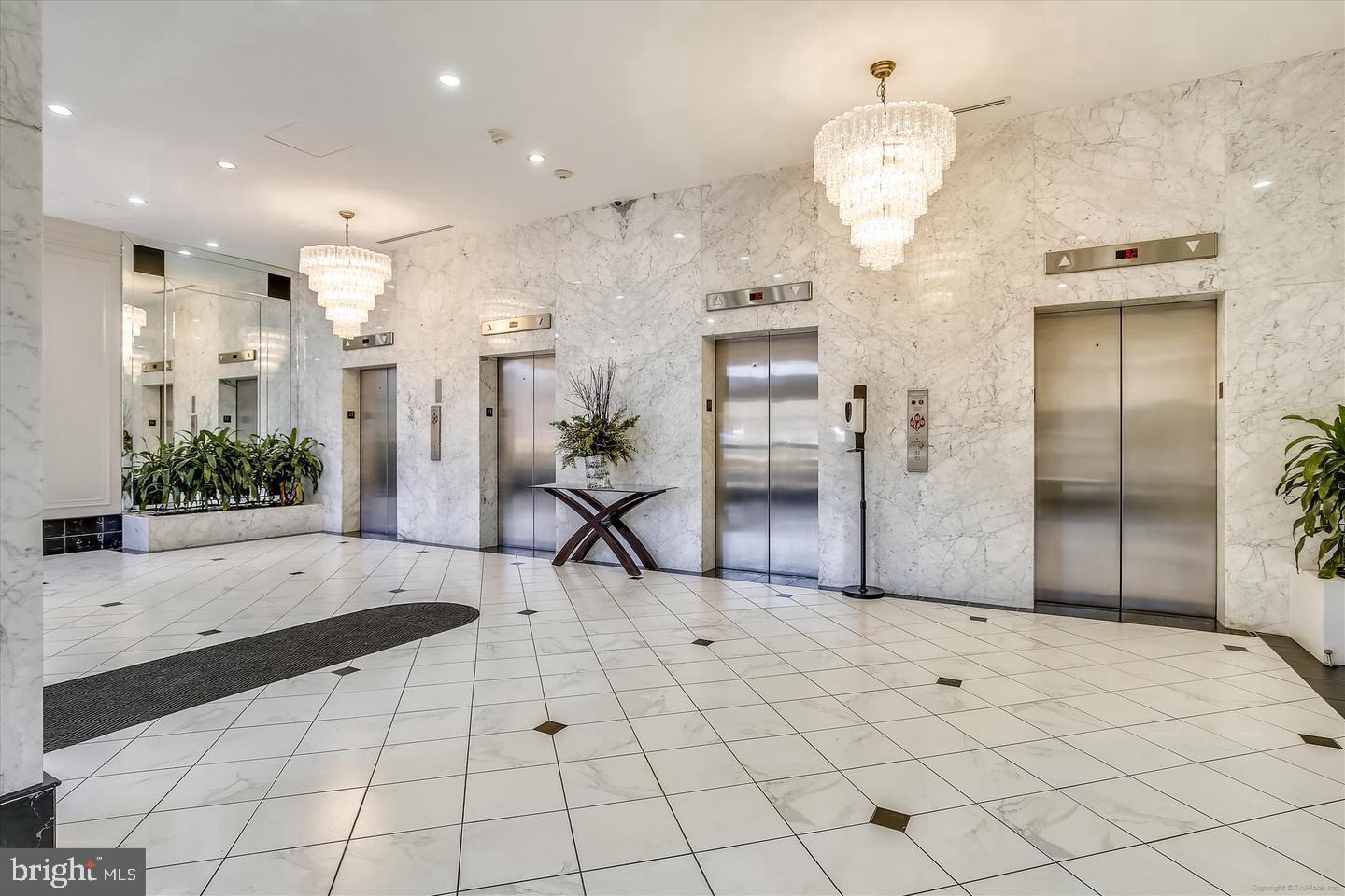400 Madison Street, Unit 603 Alexandria, VA 22314 - Photo 35 of 46 a view of a living room and chandelier