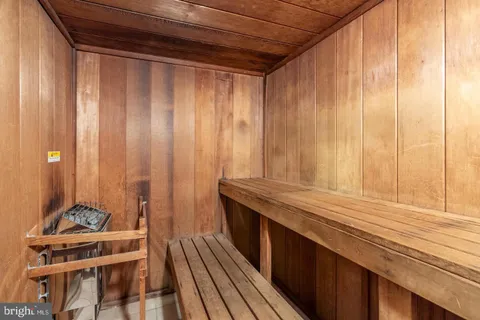 a very nice looking room with wooden floor and furniture