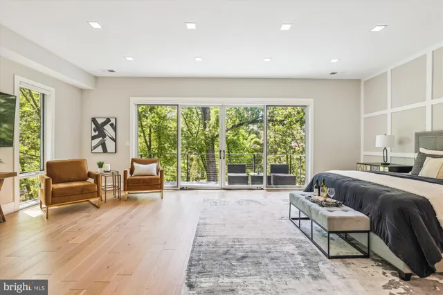 a spacious bedroom with a bed and a couch