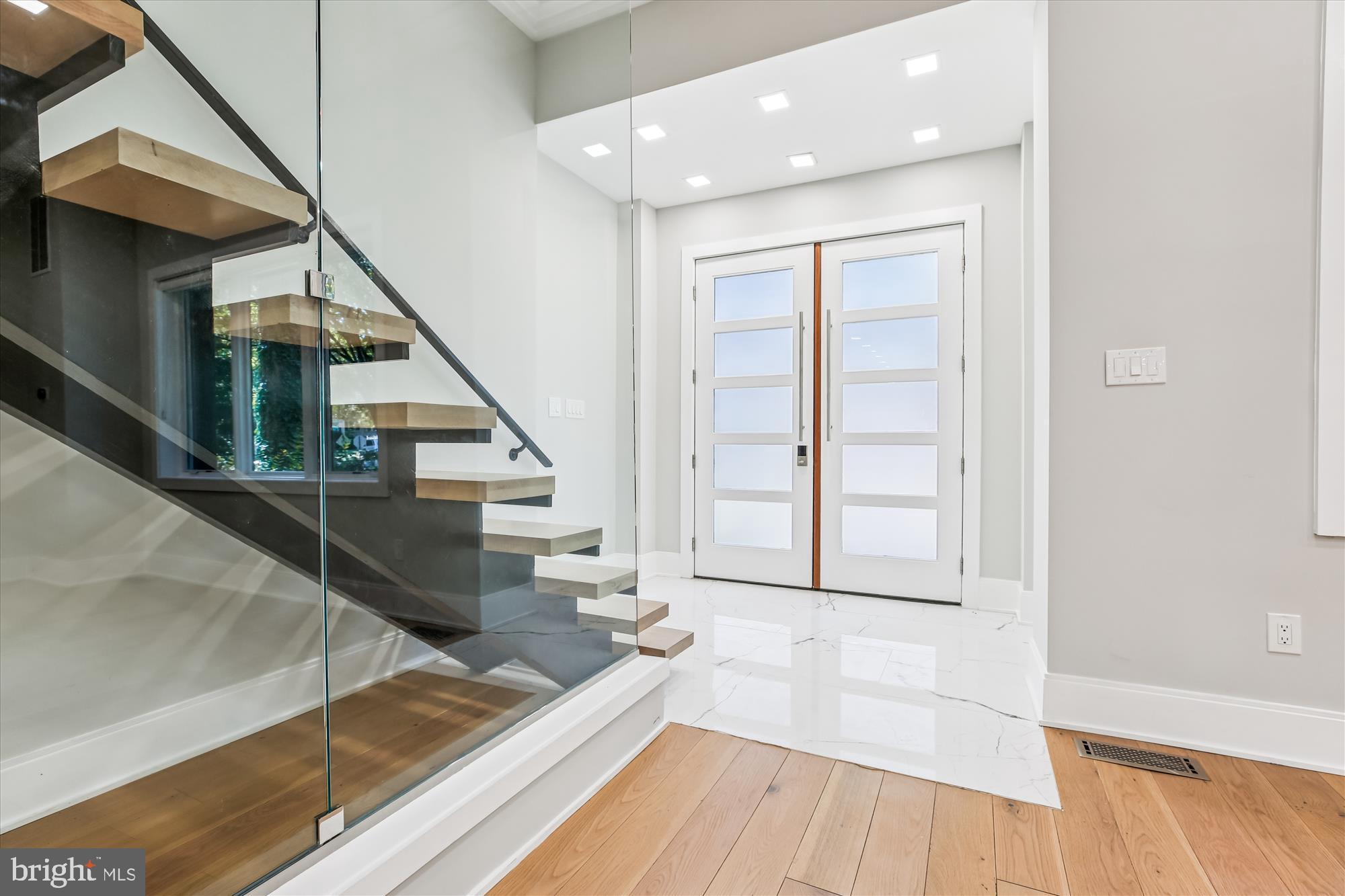 5706 Nevada Avenue Northwest Washington, DC 20015 - Photo 2 of 39 a view of entryway and hall with wooden floor