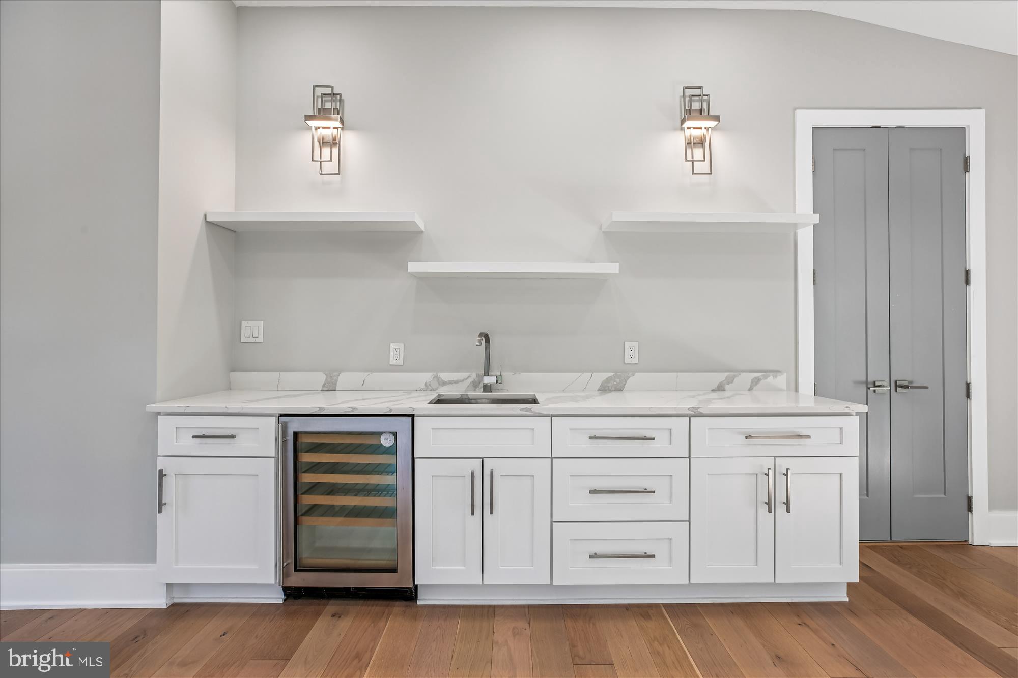 5706 Nevada Avenue Northwest Washington, DC 20015 - Photo 22 of 39 a kitchen with white cabinets and sink