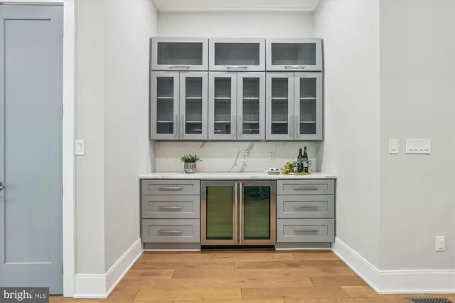 a view of kitchen with granite countertop cabinets and sink