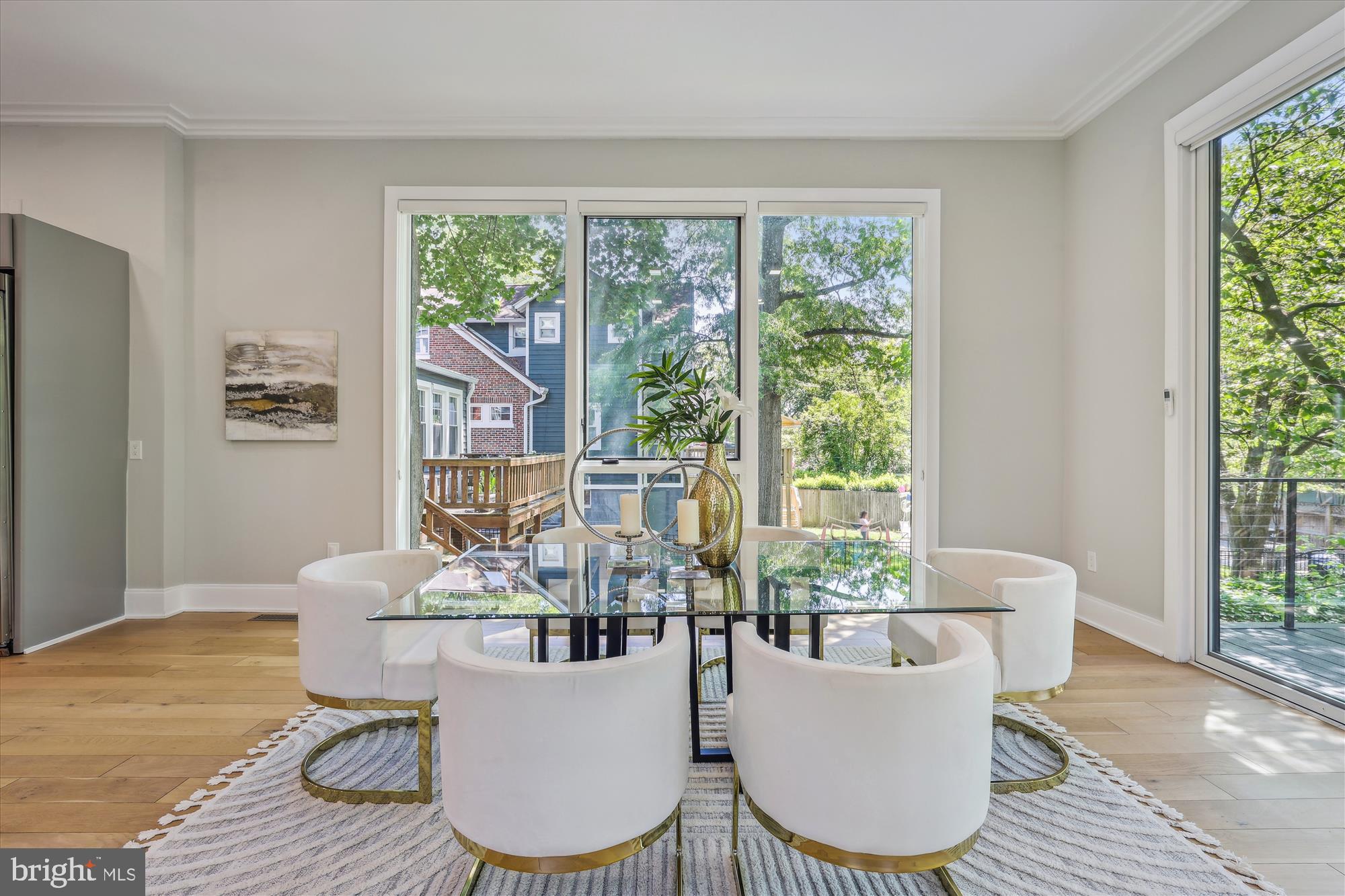 5706 Nevada Avenue Northwest Washington, DC 20015 - Photo 8 of 39 a living room with furniture a large window and dining table