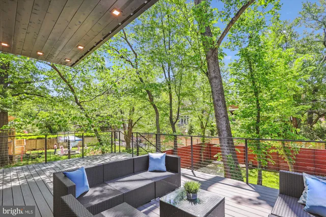 a view of a patio with couches and a fire pit