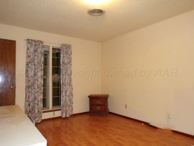 1620 Bluebell Street Amarillo, TX 79107 - Photo 13 of 28 an empty room with windows