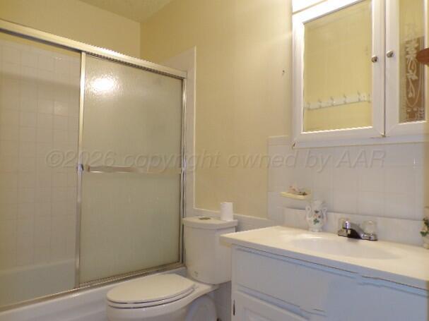 1620 Bluebell Street Amarillo, TX 79107 - Photo 15 of 28 a bathroom with a sink a toilet and shower