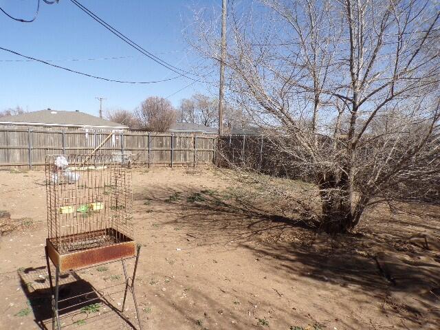 1620 Bluebell Street Amarillo, TX 79107 - Photo 22 of 28 a view of a yard with wooden fence